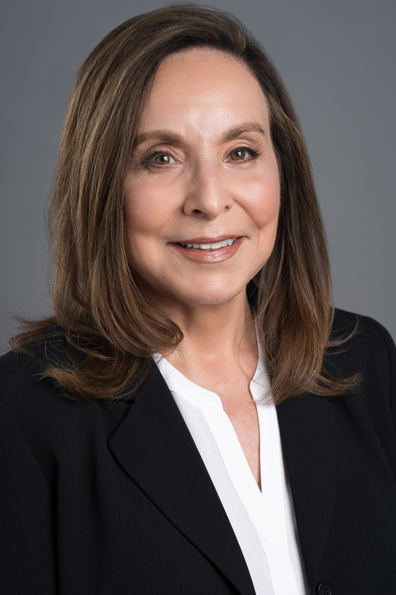 Headshot of femame in black blazer